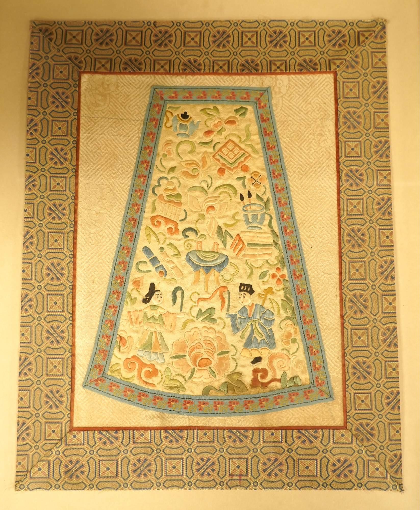 Two Chinese silk panels with polychrome embroidery, one housed in a faux bamboo frame, largest 47cm high